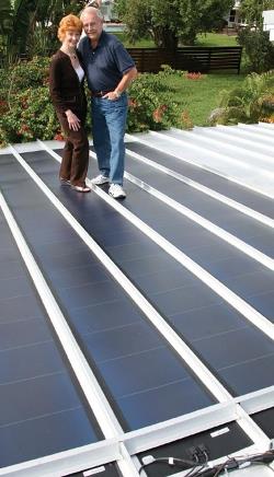 Cindy Kessler and John Eriksen on the solar roof